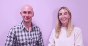 10x Product Talks hosts Director Product Ross Harty & Director Client Delivery Katie McNeill stand in front of purple wall