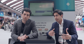 Two people in conversation on stage at Money20/20 Europe 2026: Nikhil Sengupta, Commercial Director at 10x Banking, and Ohad Kotler, CEO and Co-Founder of Tweezr, discussing AI, legacy systems, and the future of core banking migration.